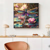 A framed diamond painting featuring a vibrant iridescent dragonfly with purple and green wings against a dark, colorful backg