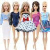 A set of five handmade casual doll outfits for 1/6 scale dolls featuring various colors and styles.