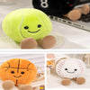 A cute orange sports-themed plush doll with stitched details and tan feet.