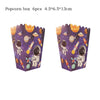 A pair of purple popcorn boxes decorated with outer space astronauts and planets for party decor.