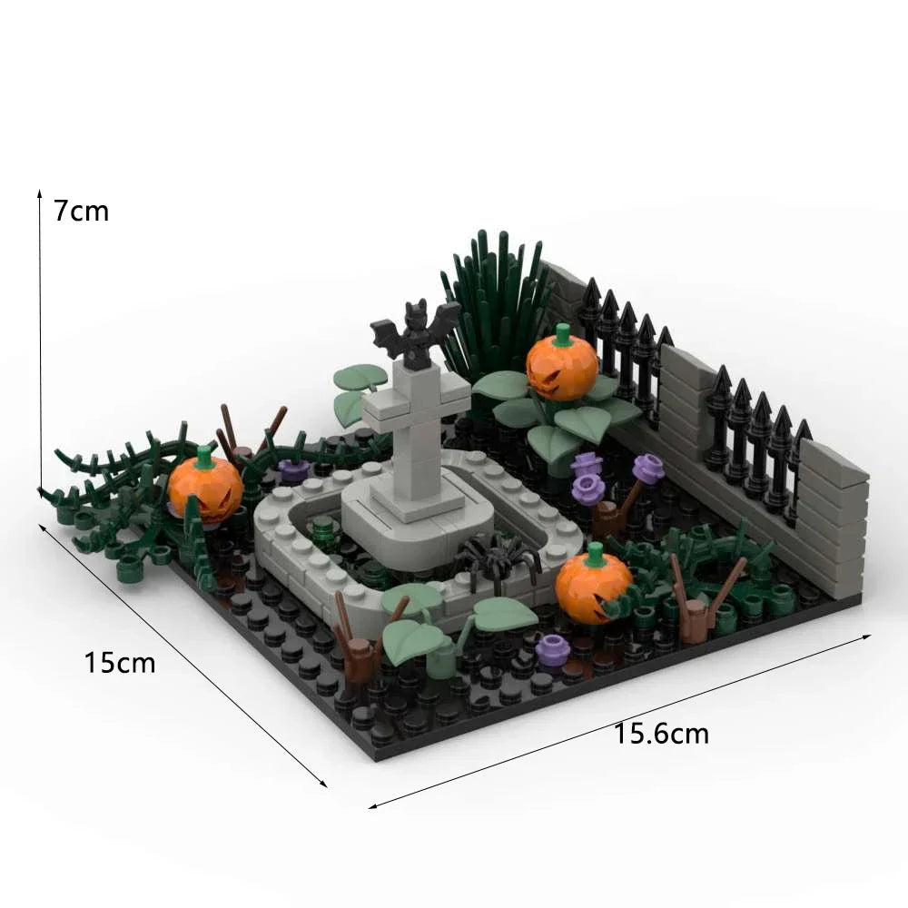 A miniature haunted house diorama featuring a stone cross, foliage, and a dark fence built from building blocks.