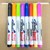 A set of colorful magical water painting pens in various colors arranged vertically on a cardboard background.