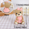 A light pink bear cake topper featuring a cute bear character with a bow, shown from the back and side views.