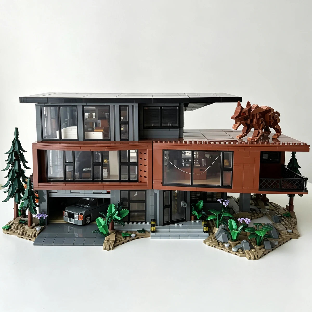 A detailed model of a haunted vampire mansion built from dark brown and gray blocks, featuring a multi-level structure and su