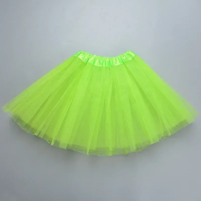 A bright lime green three-layer tutu skirt for girls displayed flat.