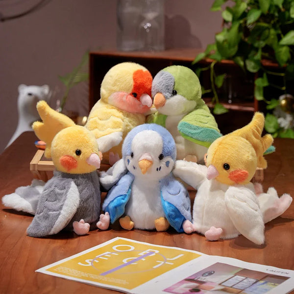 A collection of cute parrot plush finger puppets in various colors including yellow, green, and gray.