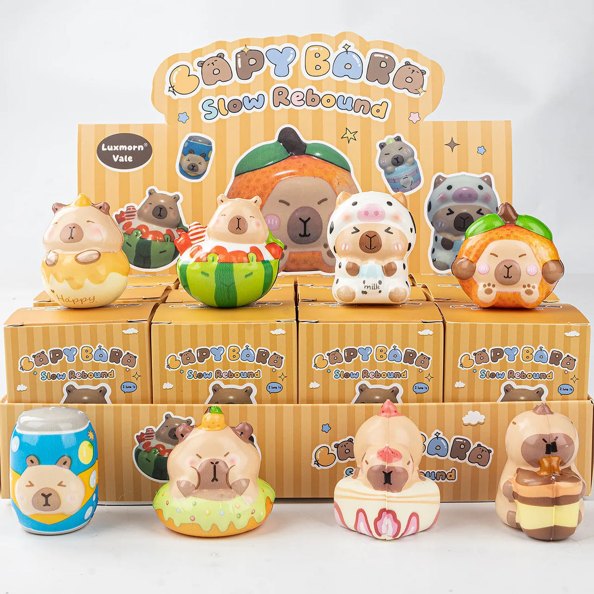 A set of 12 squishy stress relief toys featuring cute animal and food characters in various colors and shapes.