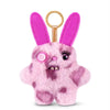 A pink fluffy alien plush toy with large ears and a gold keychain ring.