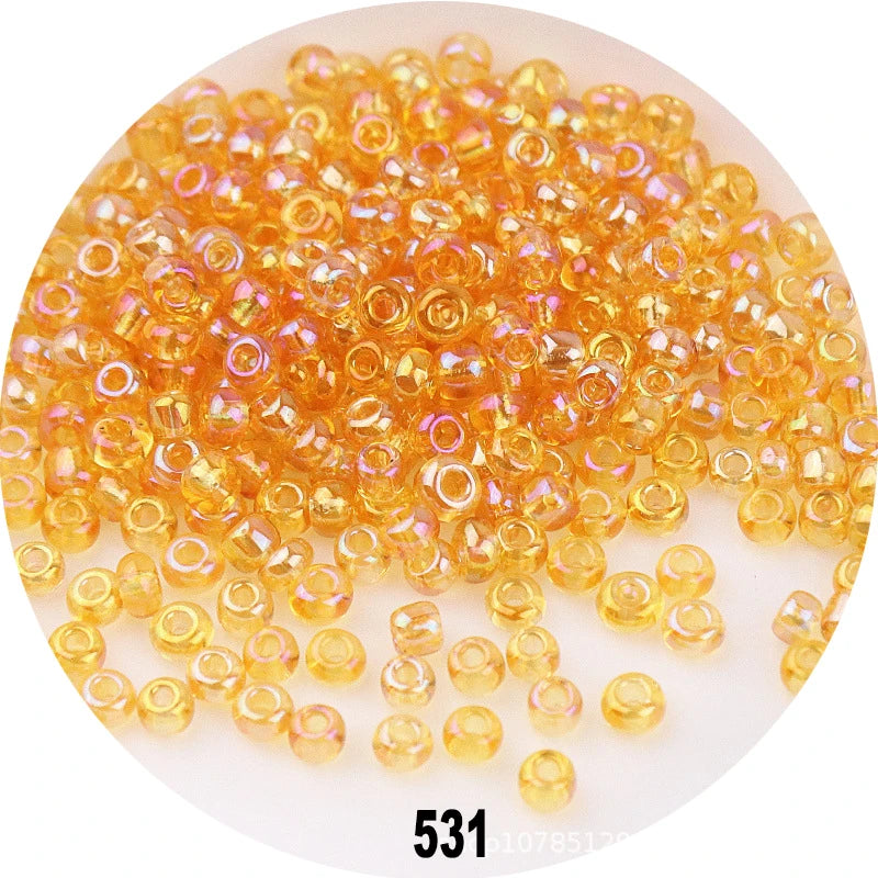 A pile of colorful round loose glass seed beads for jewelry making