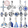 Sterling silver charm beads set featuring cross, angel, and evil eye designs for DIY jewelry making