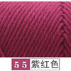 A close-up of a skein of deep magenta yarn used for knitting or crochet projects.