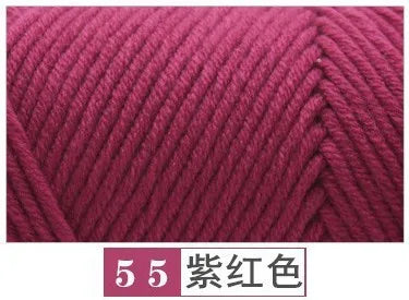 A close-up of a skein of deep magenta yarn used for knitting or crochet projects.