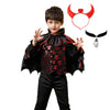A young boy wearing a black vampire bat costume set with a cape, shirt, pants, and head accessories.