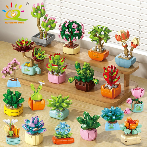 Un ensemble de blocs de construction colorés de plantes succulentes et de fleurs, de tailles et couleurs variées, disposés su