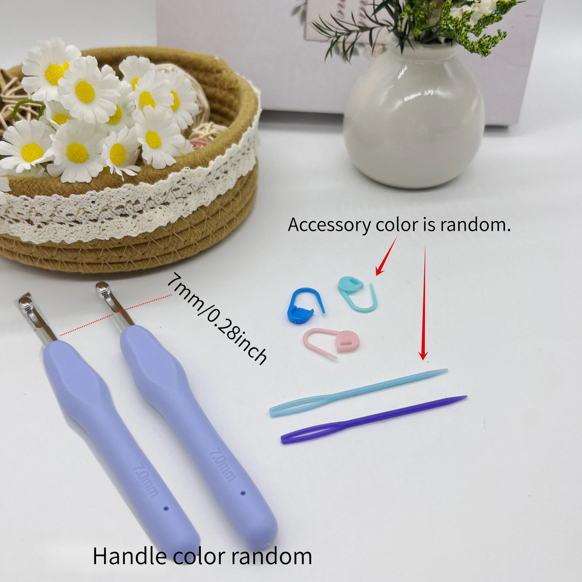 A set of ergonomic crochet hooks, stitch markers, and needles with random colors displayed next to a woven basket and a white