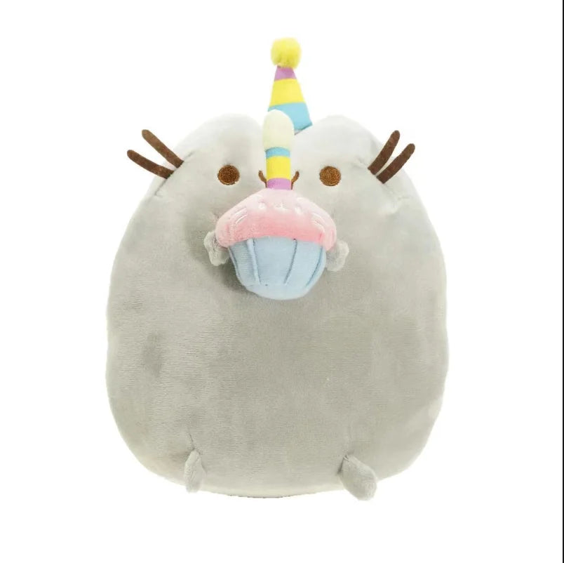 A soft gray plush cat toy with a yellow and multicolored horn.