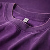 A close-up of a purple men's retro washed heavyweight cotton t-shirt showing the neckline and tag.