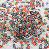 A pile of colorful cartoon polymer clay slices in various shapes and colors for slime and craft projects
