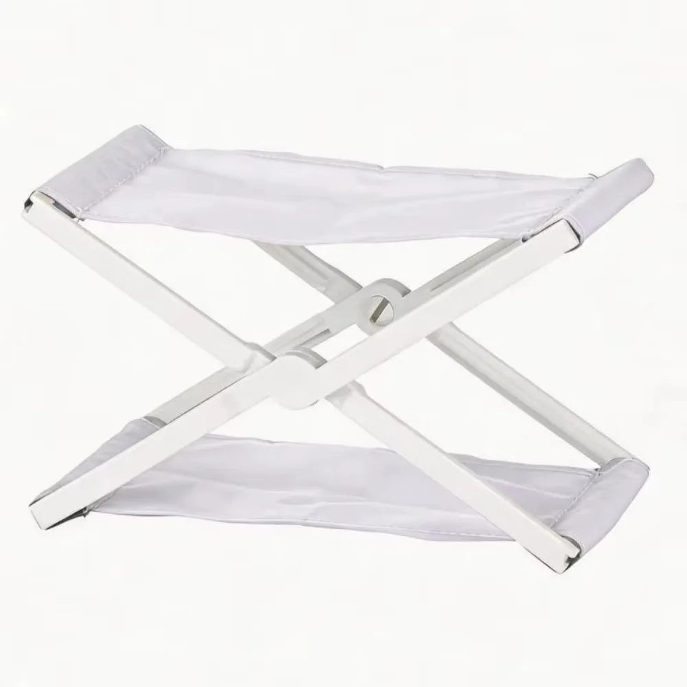 A white foldable camp pillow with a light gray fabric cover and a silver frame.