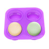 Purple silicone soap mold with four cavities, featuring two round soap shapes in beige and light green.