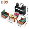 A set of 1:12 scale dollhouse furniture including a piano, chair, and small table accessories.