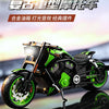 A detailed die-cast model of a green and black motorcycle with gold accents, shown in a dynamic angle.