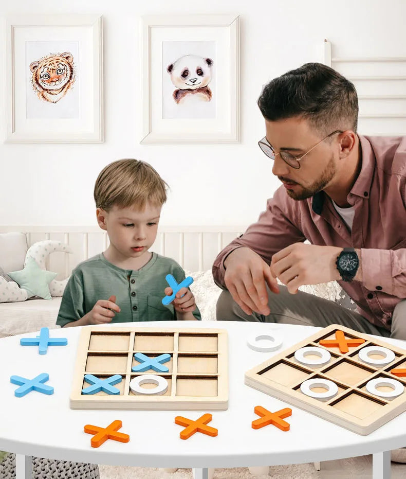 A wooden tic tac toe board game with various colored wooden pieces laid out on a white table.