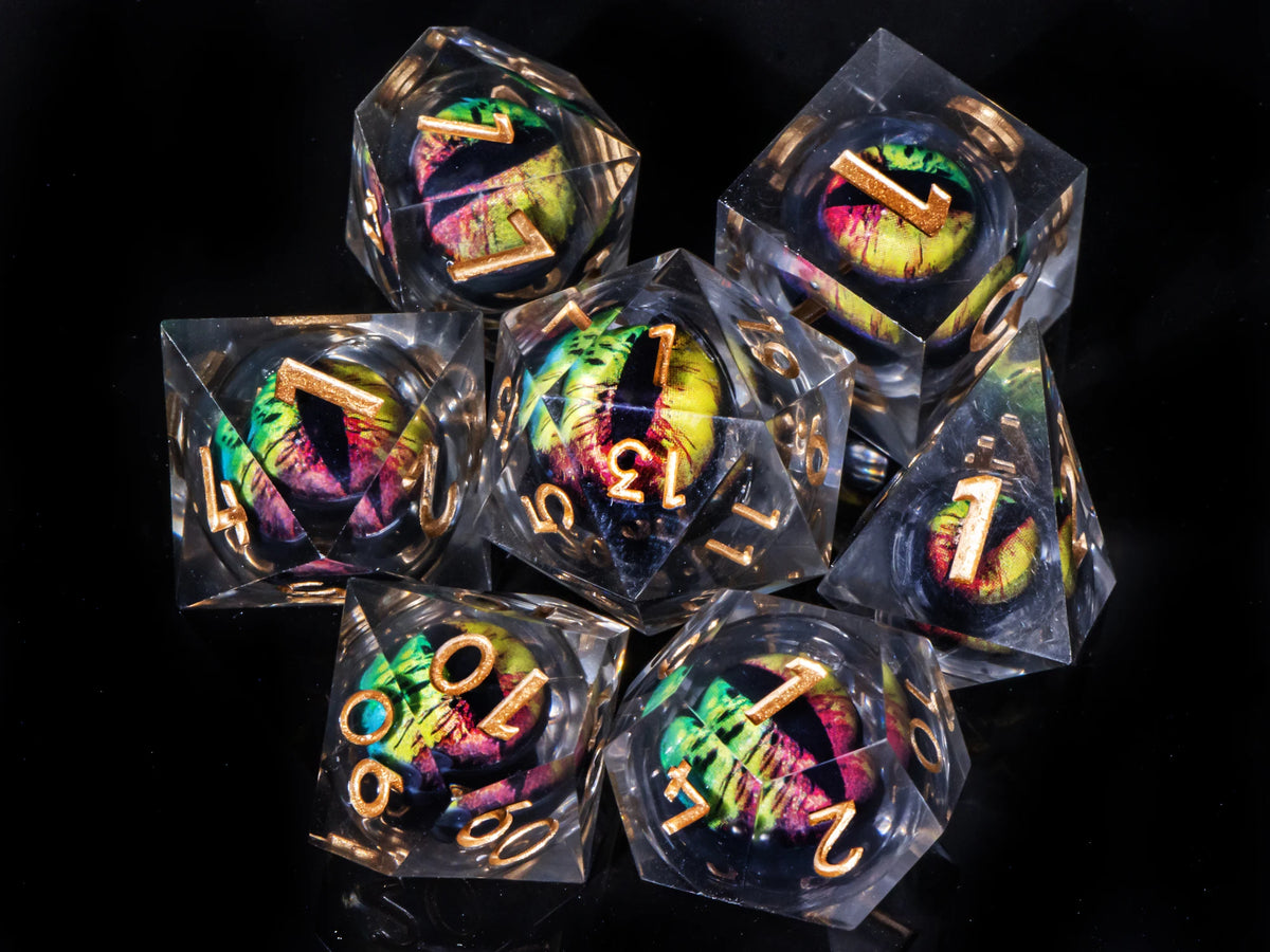 A collection of seven liquid core resin polyhedral dice, including a d10 and d12, displayed against a black background.