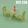 A dollhouse furniture playset featuring a light green wooden chair, a round table, and a small vase with a red flower.