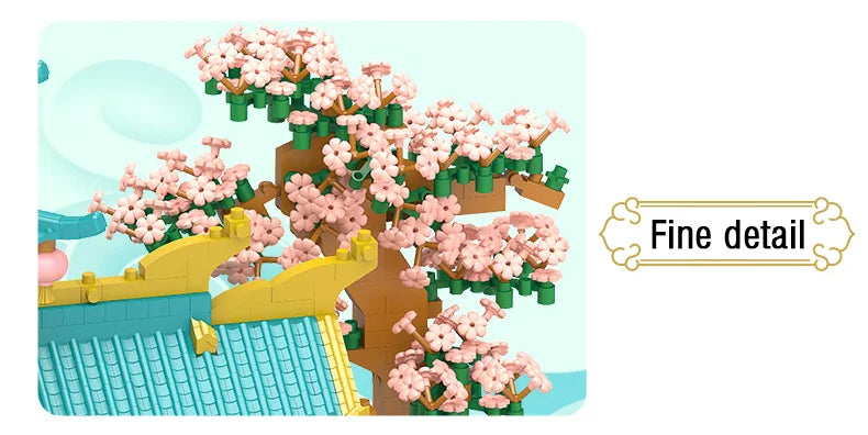 A micro building block set depicting a retro Chinese villa with pink blossoms, a tiled roof, and a courtyard garden.