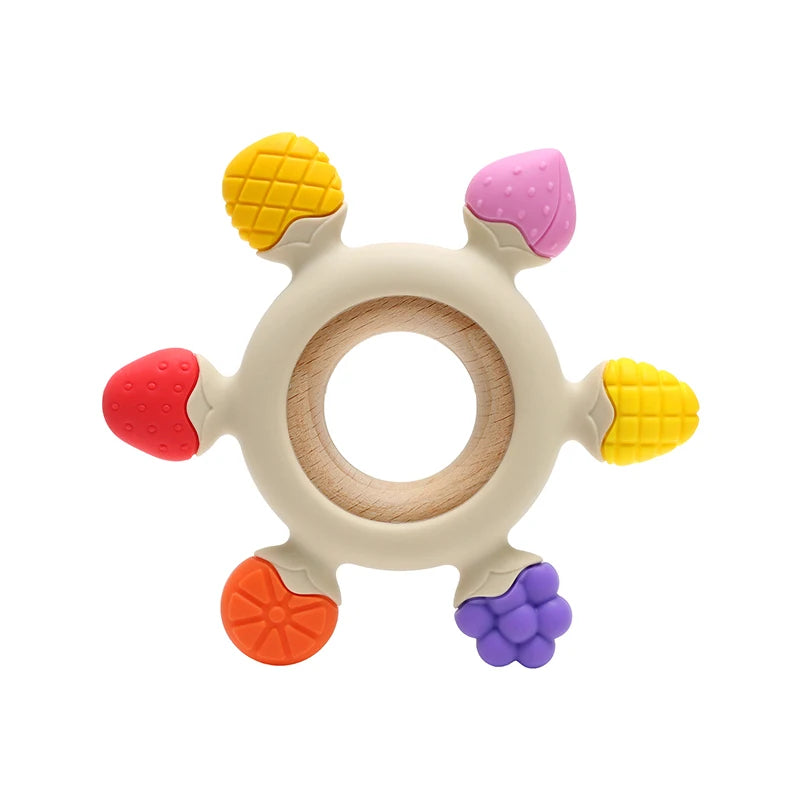 A silicone baby teether shaped like a rudder with a wooden ring and colorful silicone protrusions.