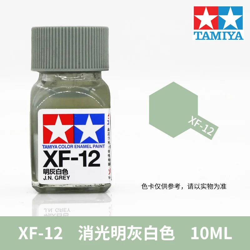 Tamiya XF-12 clear white enamel paint in a glass bottle, labeled for model building.