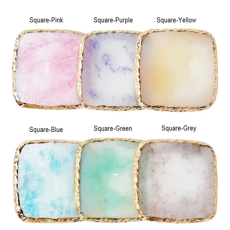 A set of six square resin nail art palettes in various colors including pink, purple, yellow, blue, green, and grey with gold