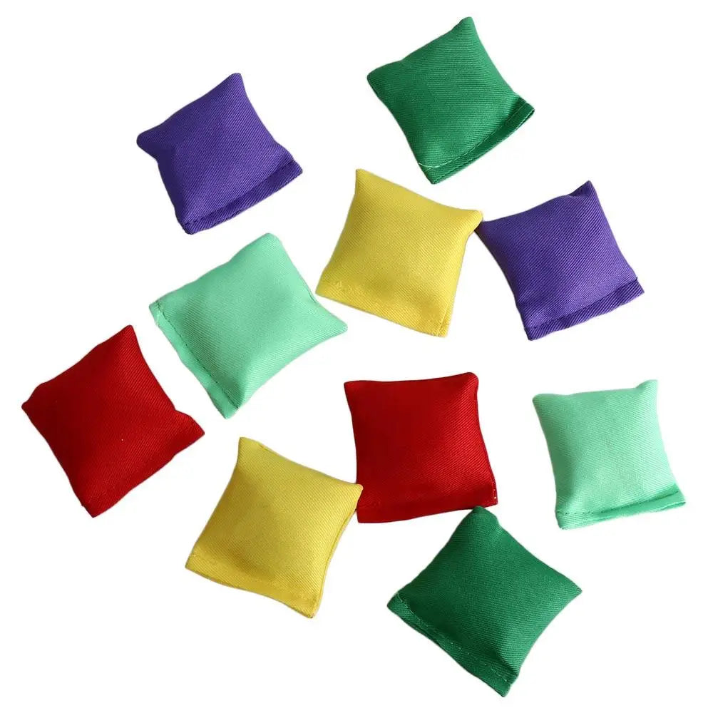 A collection of ten colorful mini bean bags in shades of purple, green, and yellow.