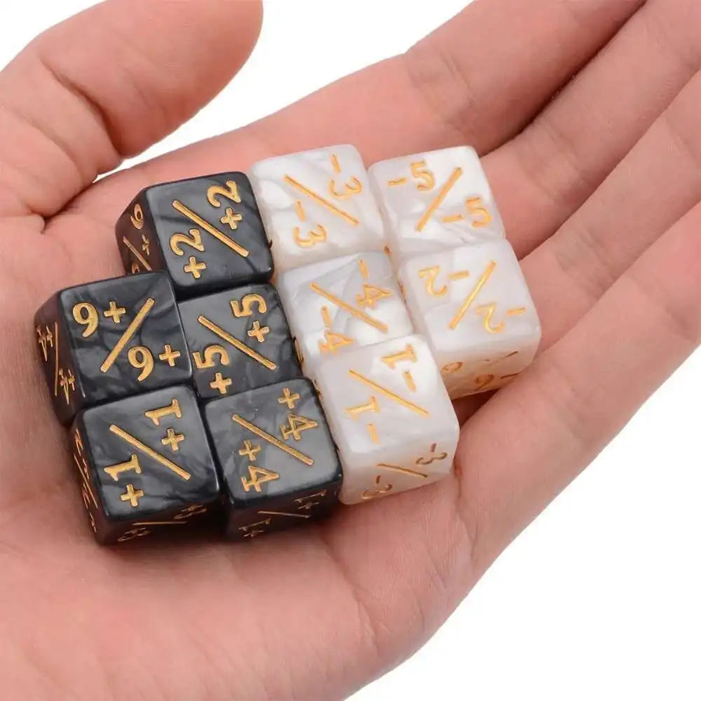 A hand holds a set of ten dual-color dice showing positive and negative numbers.