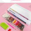 Diamond painting kit packaging showing a roll of white canvas and various colored beads and drills.