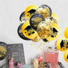 A collection of black and gold confetti balloons for graduation party decor