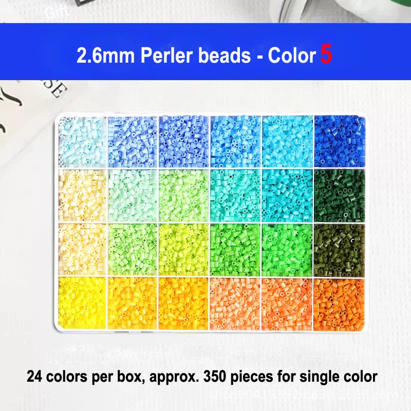 A display of 24 colors of 2.6mm perler beads arranged in a grid for craft projects.