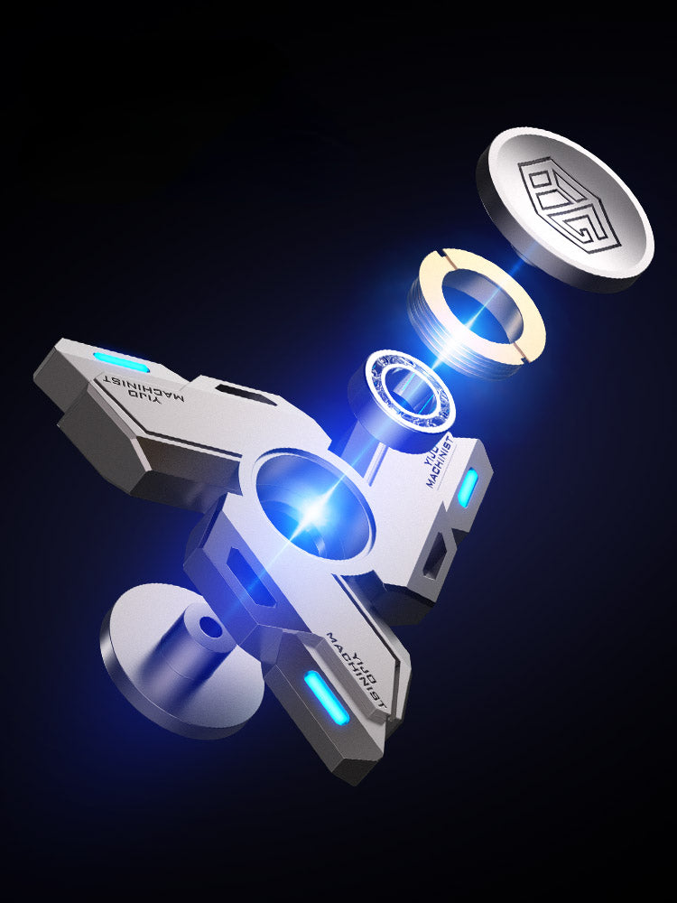 A silver metal luminous fidget spinner rotating in mid-air against a dark background.