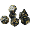 A set of seven polyhedral dice, including a d10 and d20, with a dark, smoky effect for role-playing games.