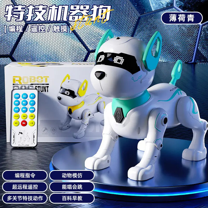 A white and teal robotic dog figure is displayed on a dark surface next to its remote control and packaging.