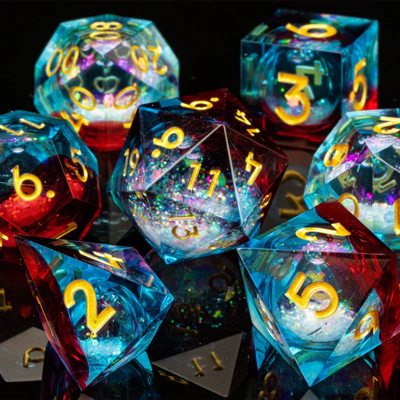 A collection of iridescent, sharp-edged resin dice in blue and red hues scattered on a dark surface.
