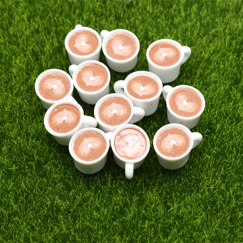 A collection of small, round, pink-colored wax melts or charms arranged on green grass.