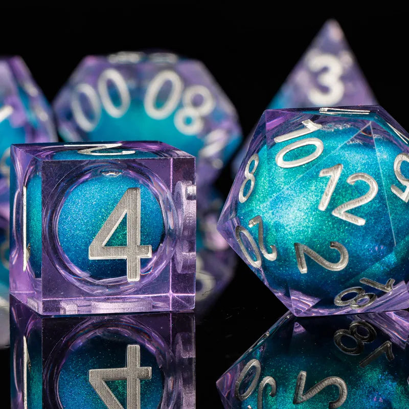 A collection of iridescent purple and blue resin dice, including a d4, d6, and d8, are displayed on a dark surface.