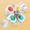 A white spinning suction cup bath toy with multiple colored cups and an upgradeable bearing system.