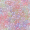 A close-up view of a 100-pack of iridescent rainbow pony beads in various shades of pink, purple, and green.
