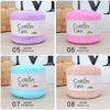Eight skeins of 100% cotton yarn in various shades including purple, pink, and blue.