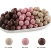 A collection of round silicone beads in various shades including oatmeal, blush pink, and chocolate brown.