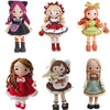 Four crochet dolls in various styles and colors including a purple doll, a blonde doll, a red-themed doll, and a light green 