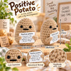 A handmade crochet potato doll with a motivational message card.